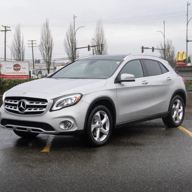 Ad for a silver Mercedes-Benz GLA on the lot